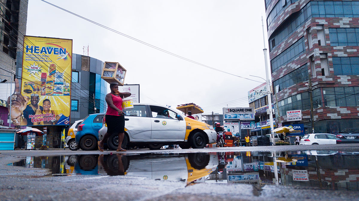 After   the   Rain Caption:   Woman   dancing   across   puddles,   Osu ,   Accra,   Ghana Credit:   Festus   Jackson   Davis